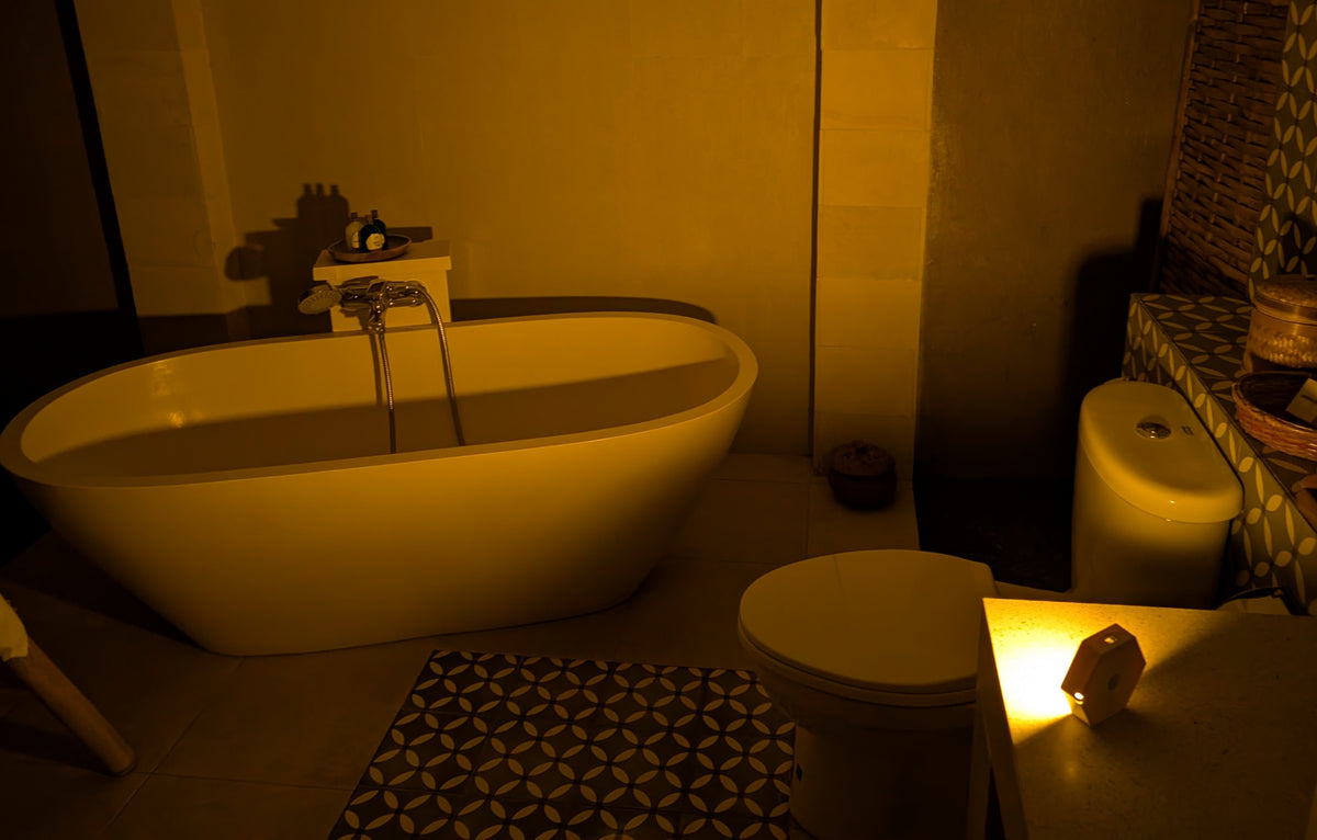 Glow Guide amber motion light mounted in bathroom